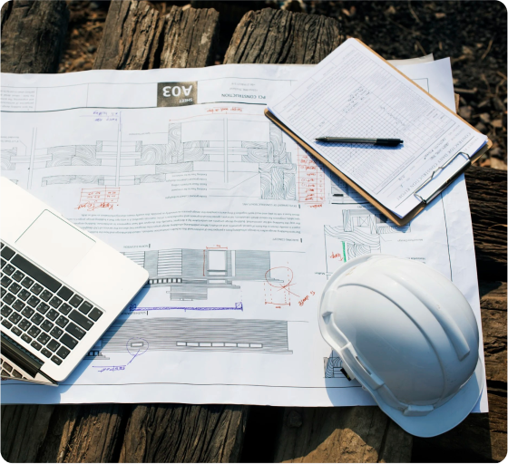 Construction site blueprint with clipboard, laptop or helmet